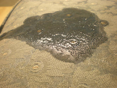 This picture is of a fabric that was cleaned and not well extracted, then protector was applied.