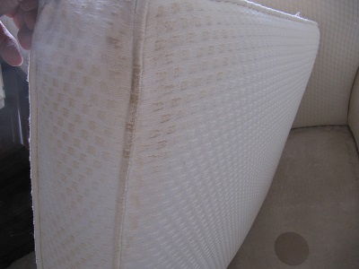 THIS DYE STAIN TRANSFERRED FROM THE PLATFORM OF THE SOFA